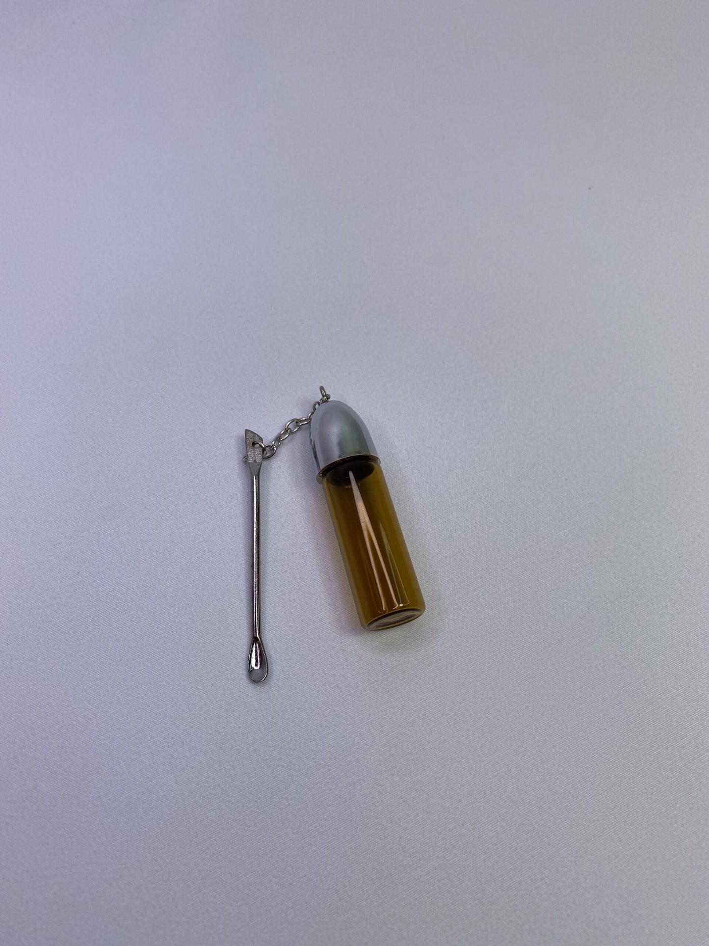 Glass stash jar with keychain spoon